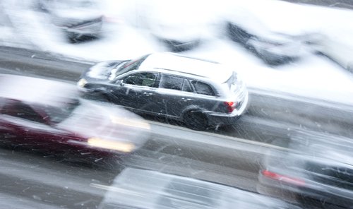 cars driving on an icy road